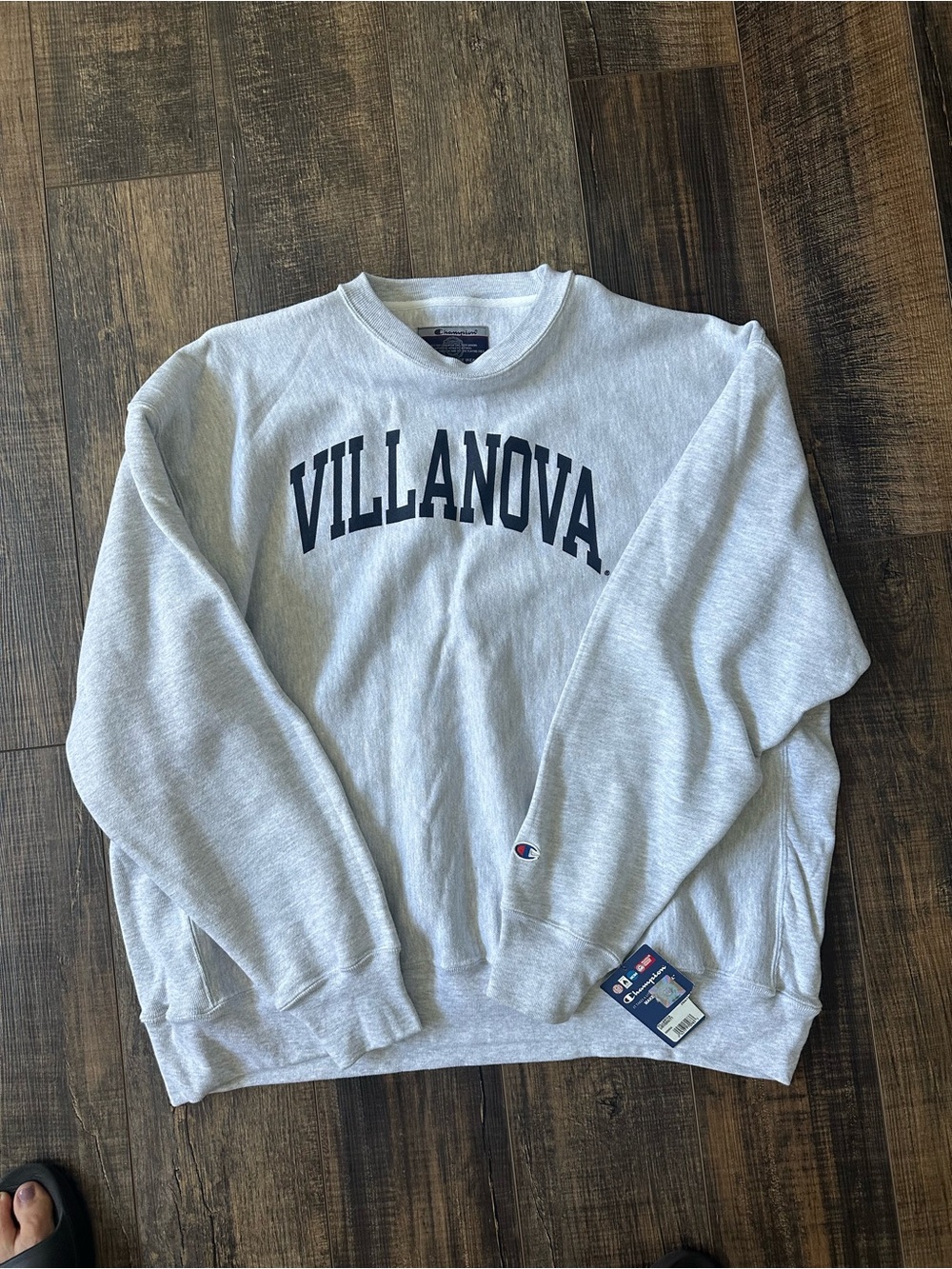 Champion Light Gray Villanova Crewneck Sweatshirt with Navy Quality Lettering.